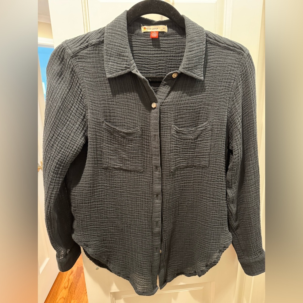 Woman’s Guaze button down shirt.
